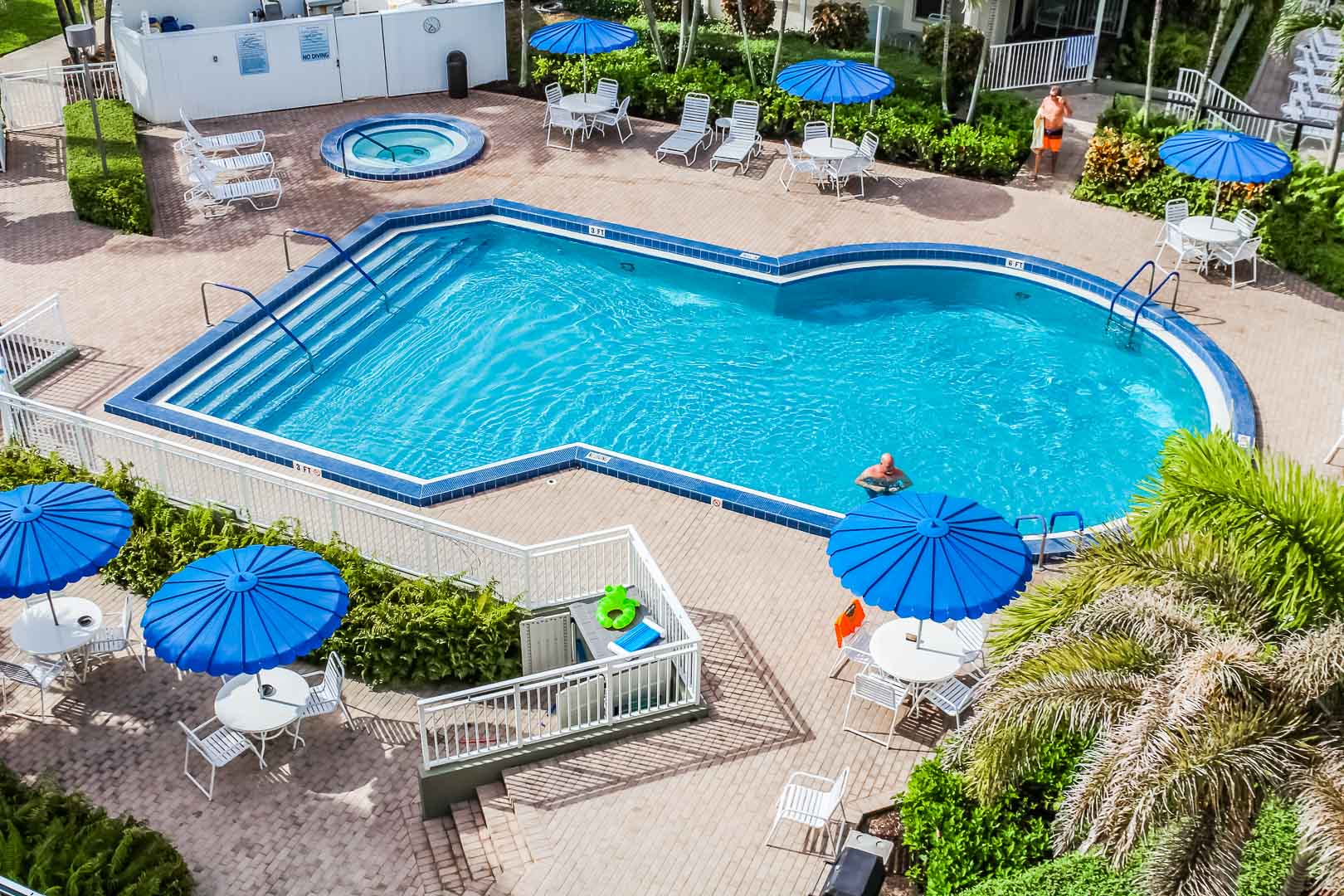 A refreshing pool and jacuzzi at VRI's Berkshire by the Sea in Florida.